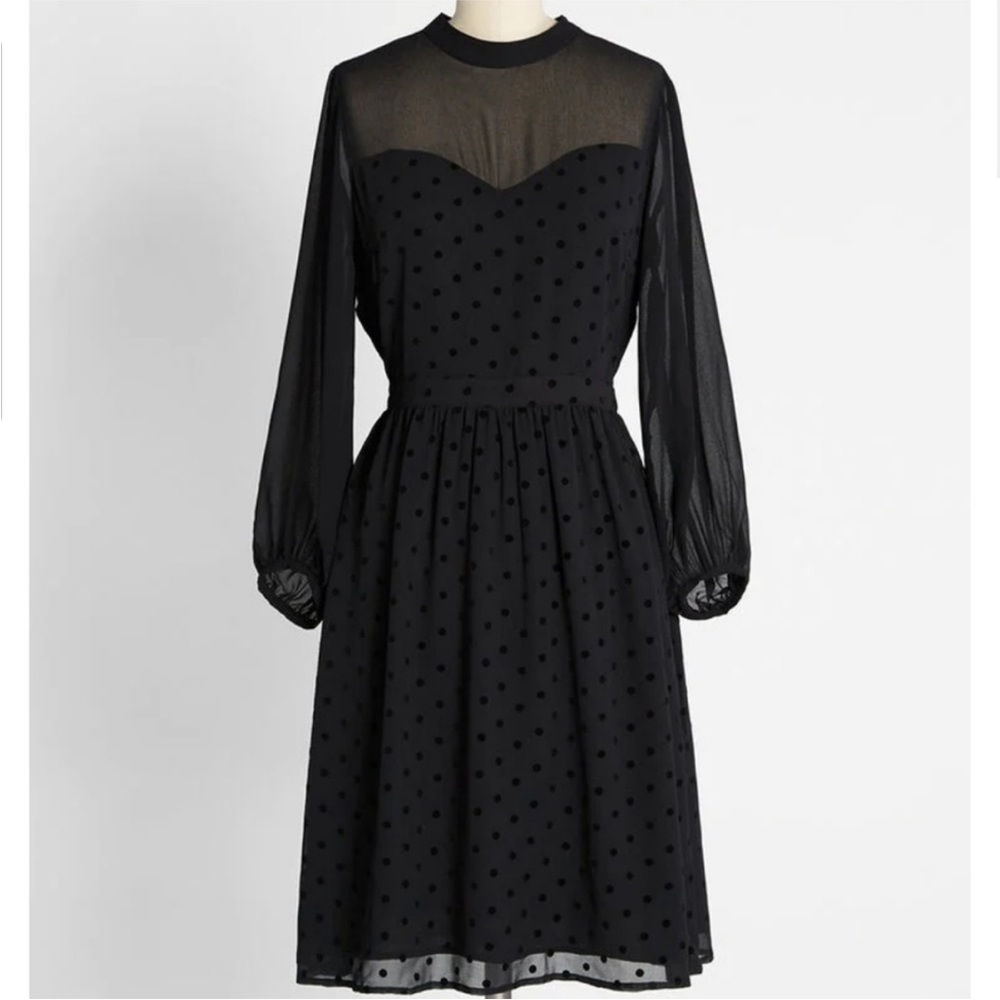 Black translucent polka dot dress.